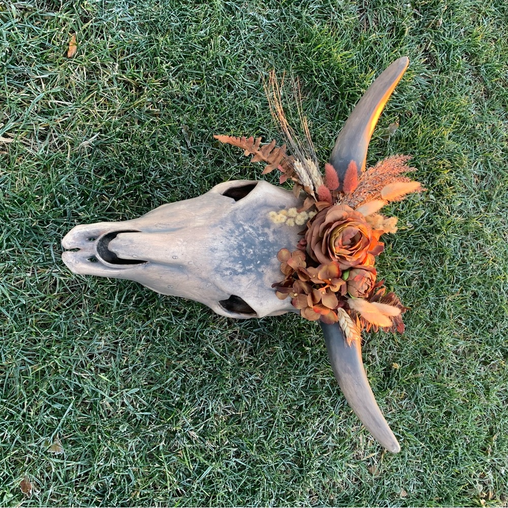 Ceramic Buffalo skull with artificial flowers, hand painted